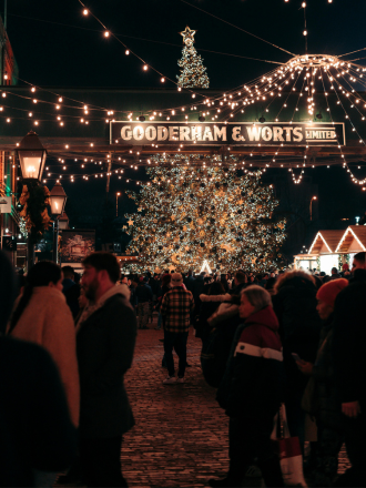People in a Christmas Market at Night